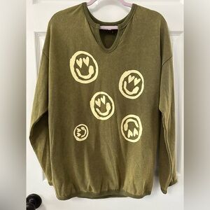 Olive green top with smiley face design